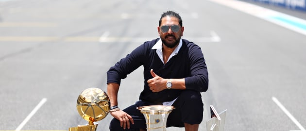 Yuvraj Singh walks The Miami Grand Prix Grid with ICC Men’s T20 World Cup Trophy