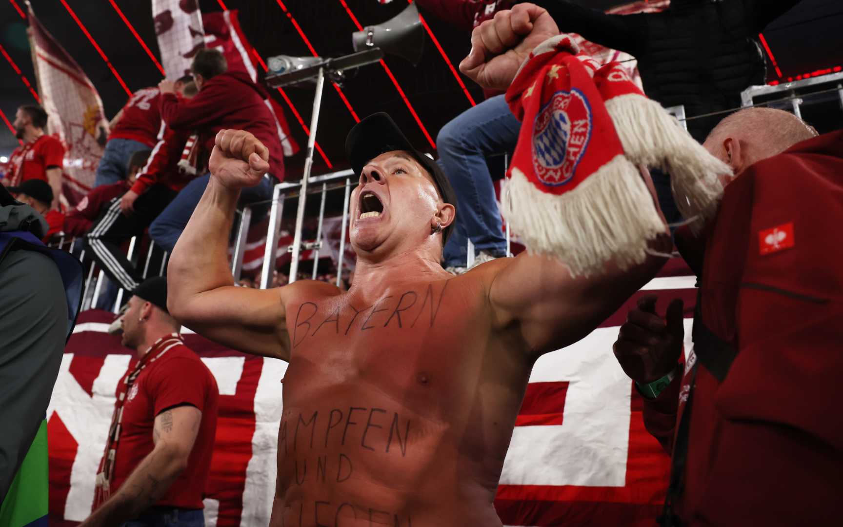 Three photographers injured, one knocked unconscious as Bayern fans storm pitch